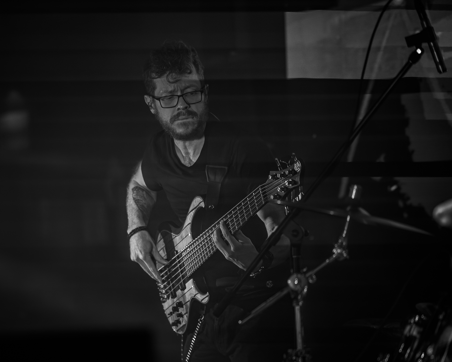 Manix Rho bassist locked in during a live performance